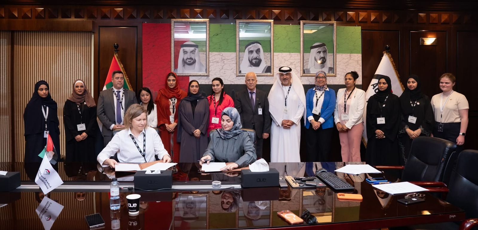 Full group photo in AUE lobby after MoU signing
