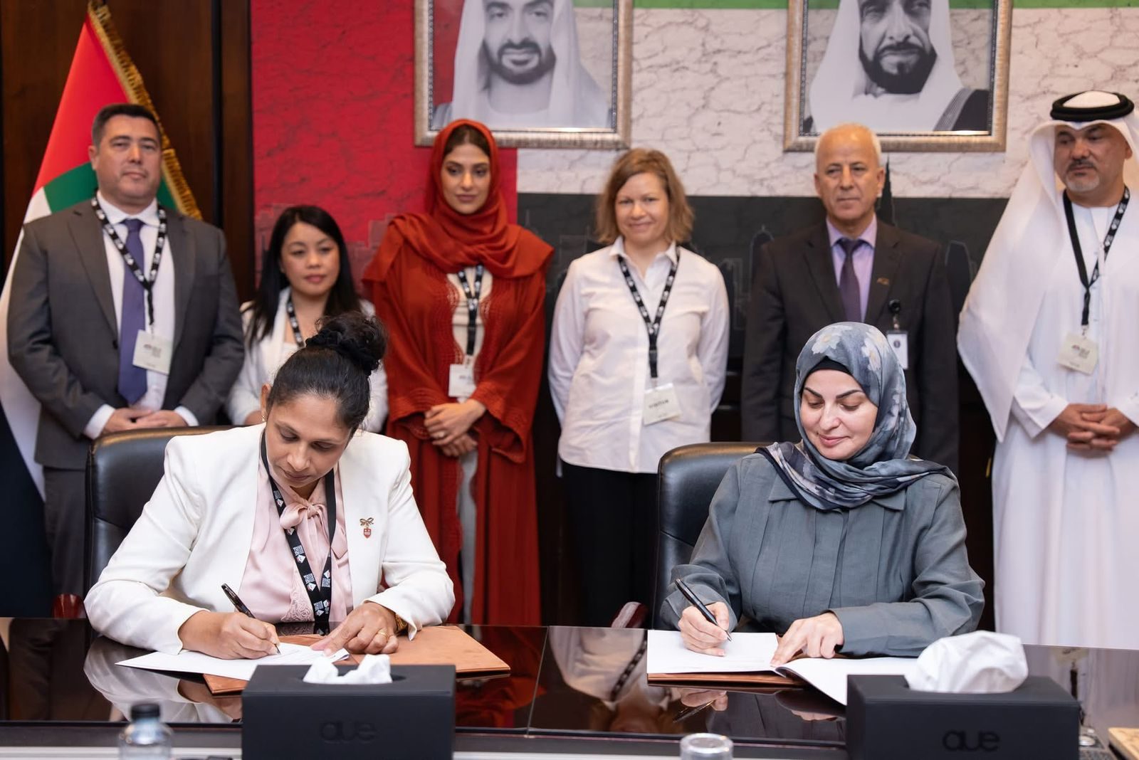 CMS Holoul and AUE representatives signing the MoU