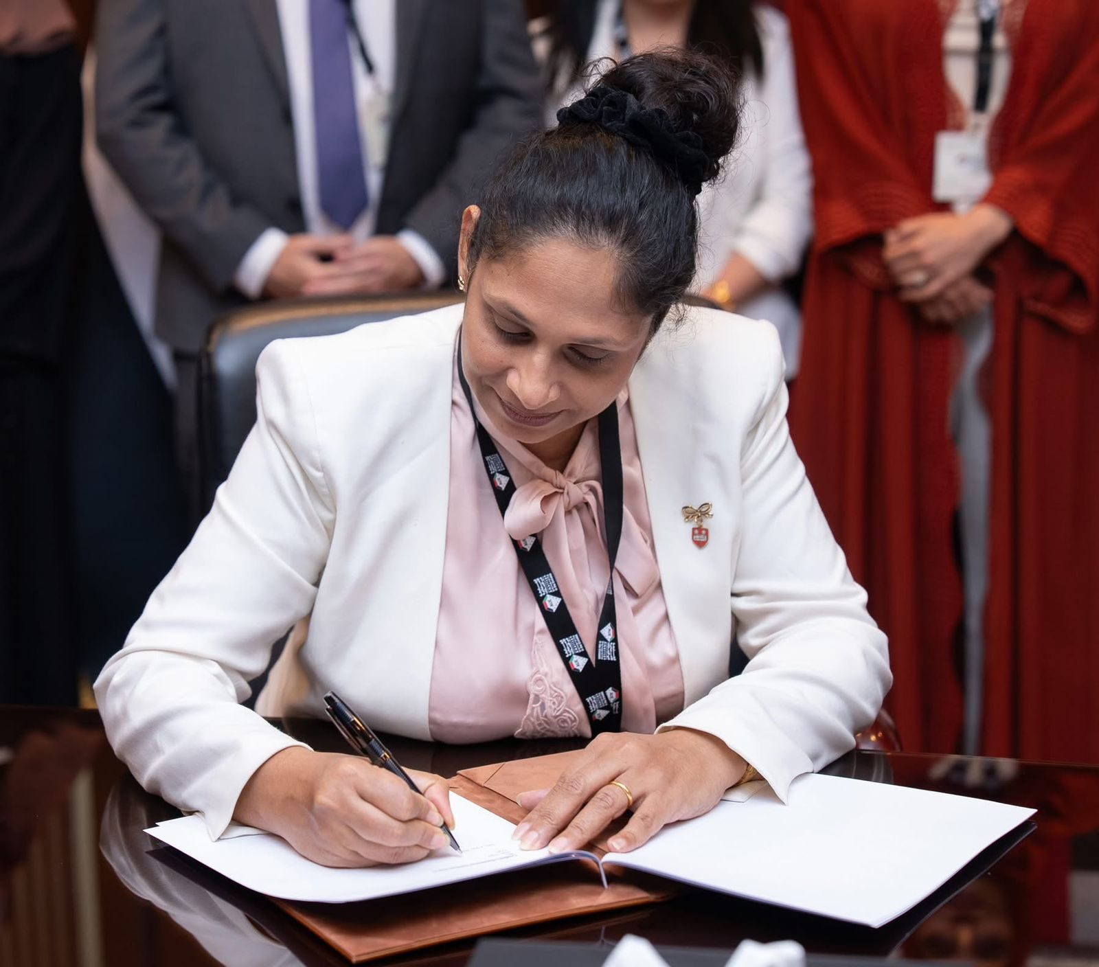 AUE representative signing the memorandum of understanding