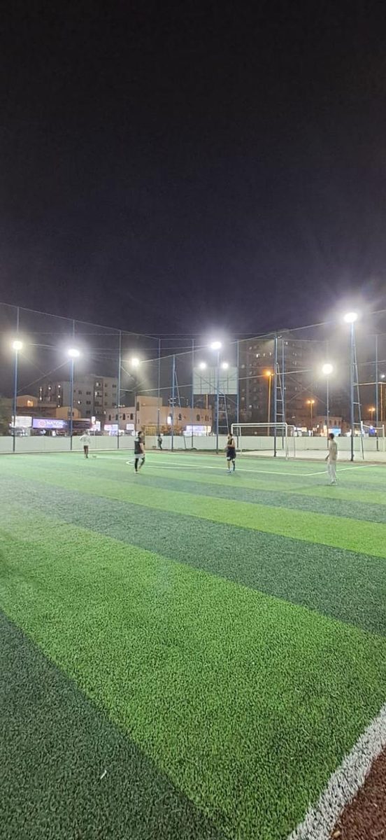 Soccer pitch under floodlights at CMS Holoul Eid tournament